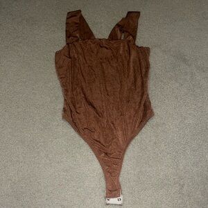 Metallic brown body suit